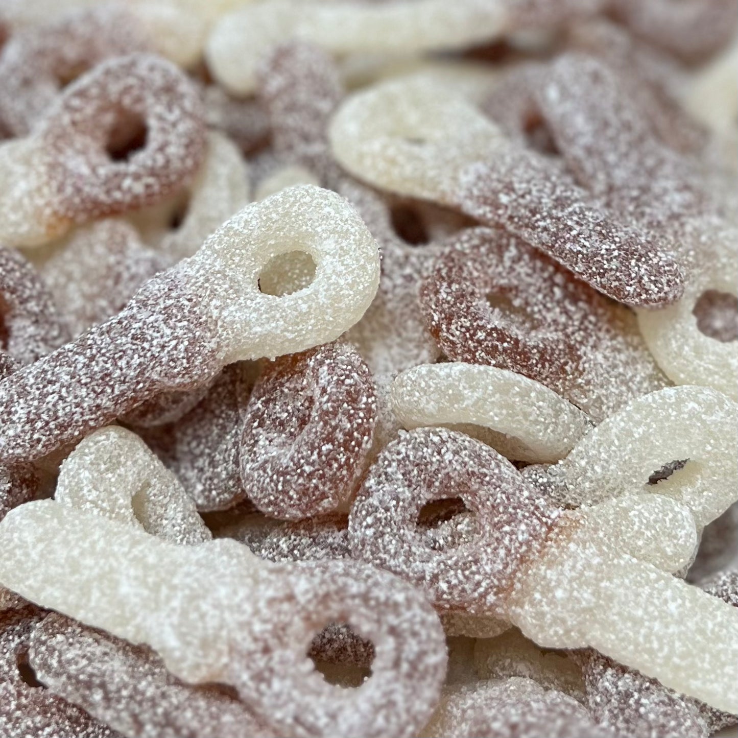 Sura colanappar (Swedish cola flavored sour pacifiers)
